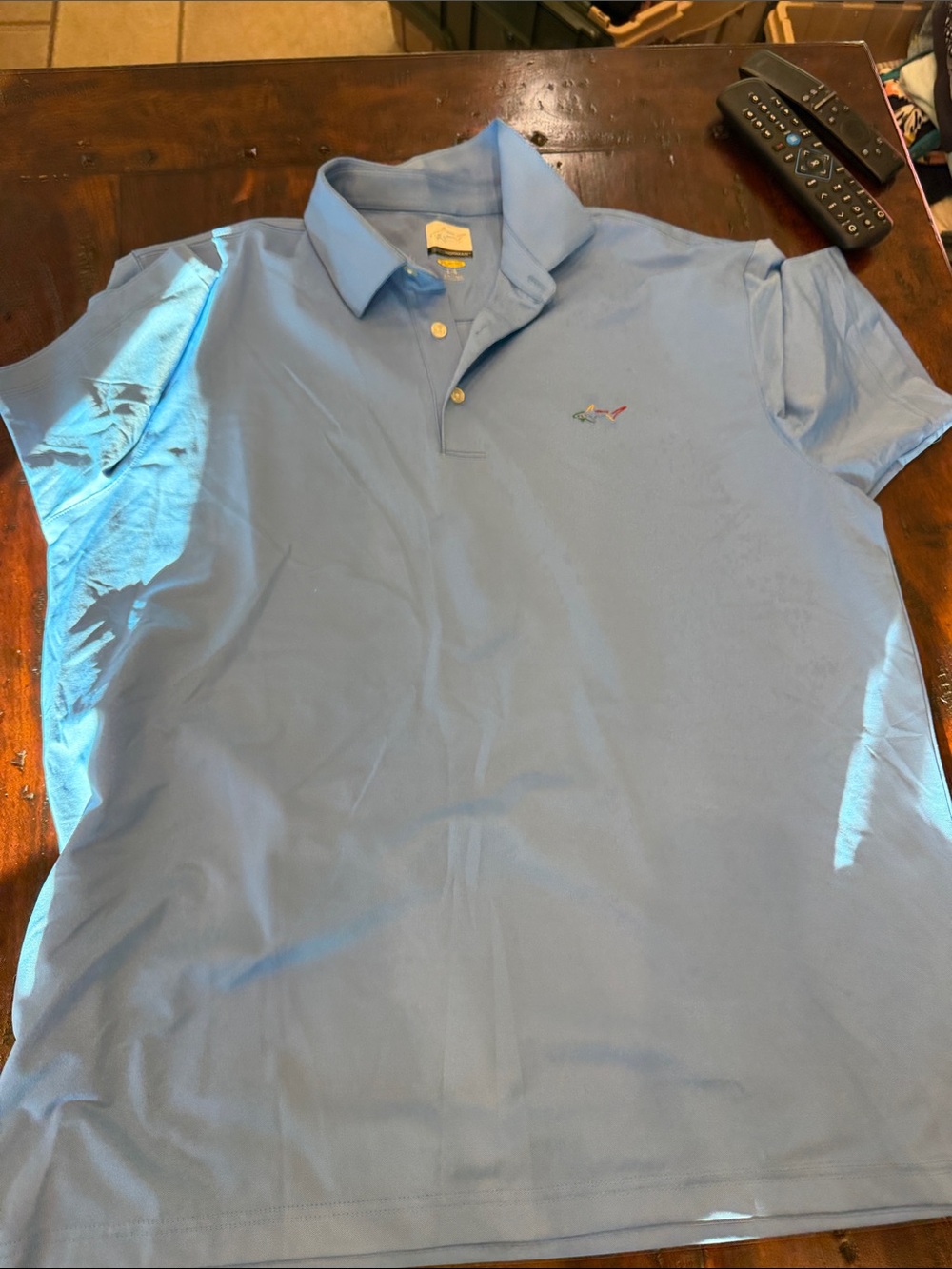 Greg Norman Collection Light Blue Polo Shirt with Subtle Shark Logo